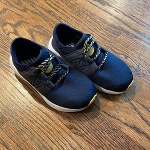 Child size 8 Blue New Balance shoes. Never worn.
